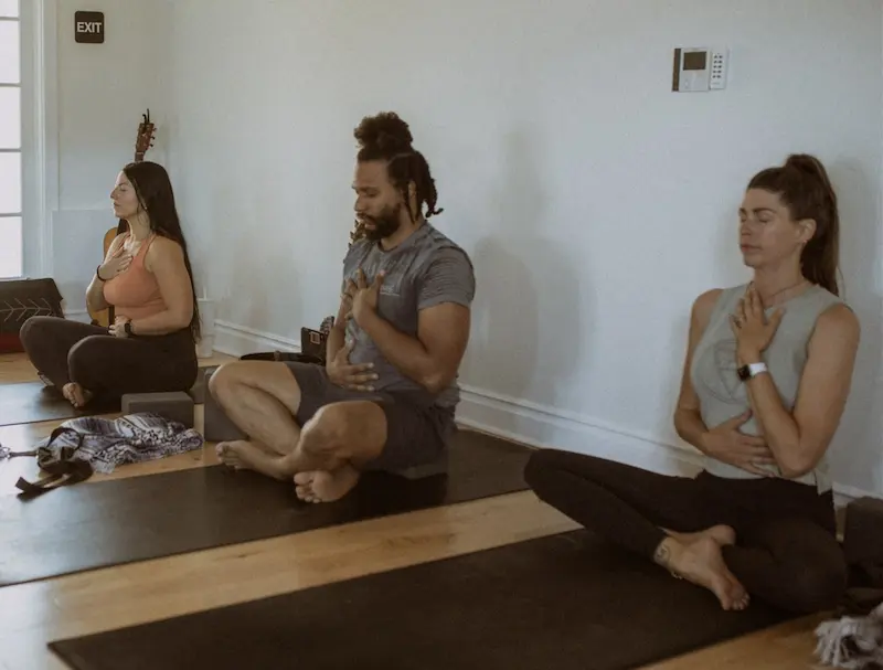 Students seated in a guided breath and meditation practice